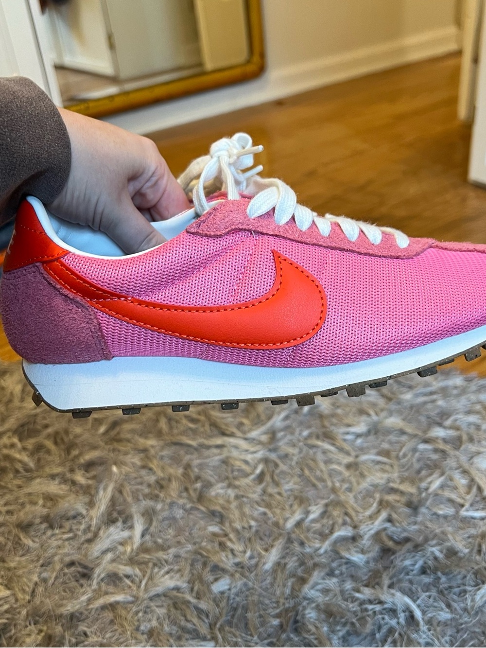 Nike Women's Pink Athletic Shoe with Red Swoosh